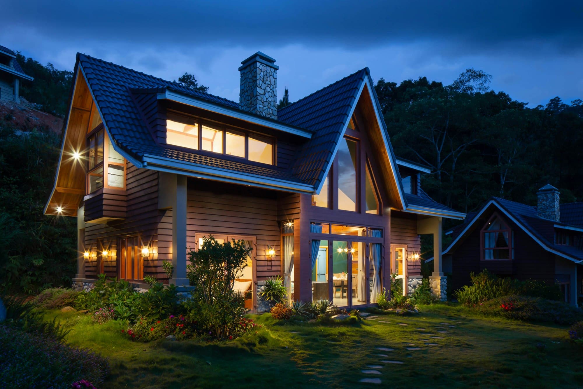 A warm, glowing home at dusk